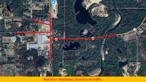 A satellite map showing Stan Tce Rd and another roadway marked with red lines indicating road closures due to traffic restrictions; surrounding areas include trees, buildings, and water bodies.